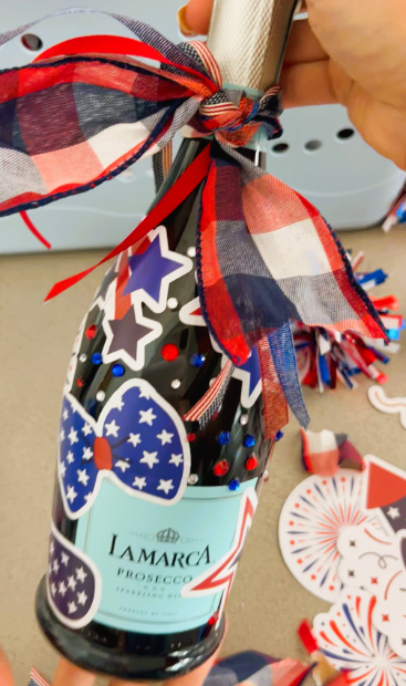 Mini Champagne Bottle decorated with patriotic stickers and ribbon