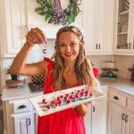 Leanna holding a platter of red, white, and blue cherries