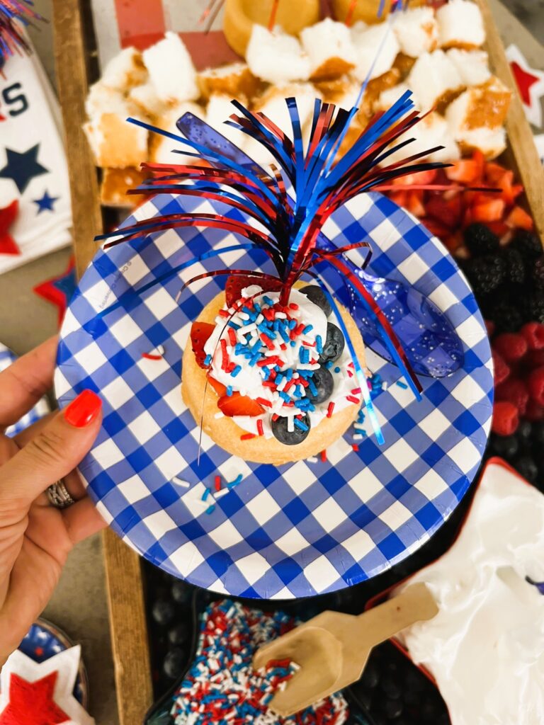DIY Berry Shortcake Bar creation on a blue gingham plate