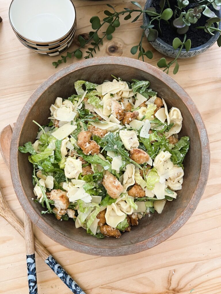 Caesar Tortellini Salad in a wooden bowl