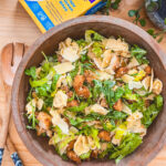 Caesar Tortellini Salad in a wooden bowl