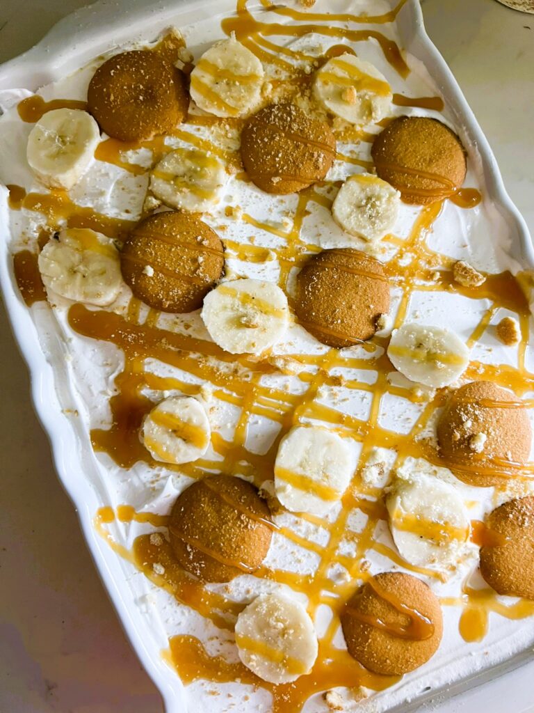 Banan Cheesecake Delight drizzled with caramel sauce