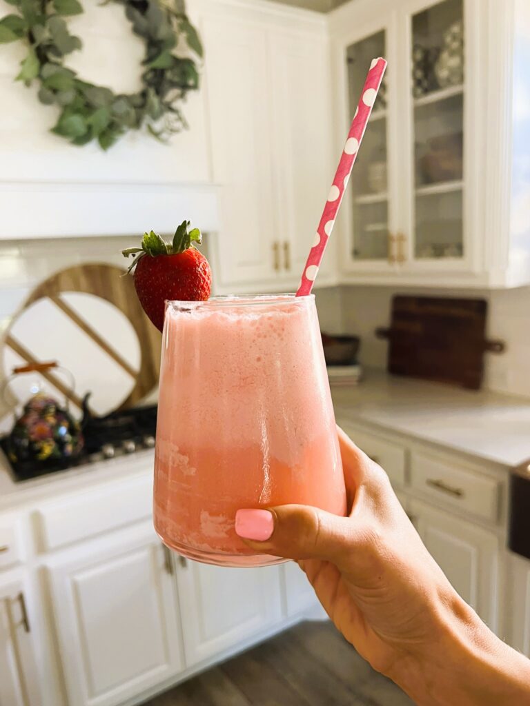 Close-up of Strawberry Champagne Float garnished with a strawberry