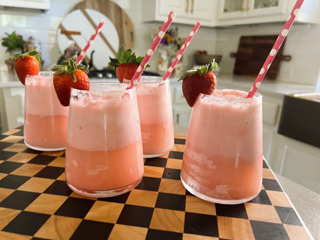 Strawberry Champagne Floats on a checkered serving board