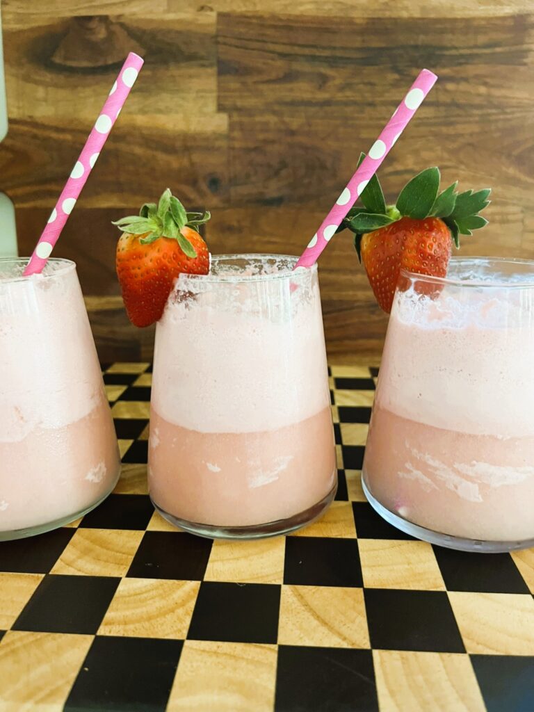 Ice Cream topped with Champagne and garnished with a strawberry