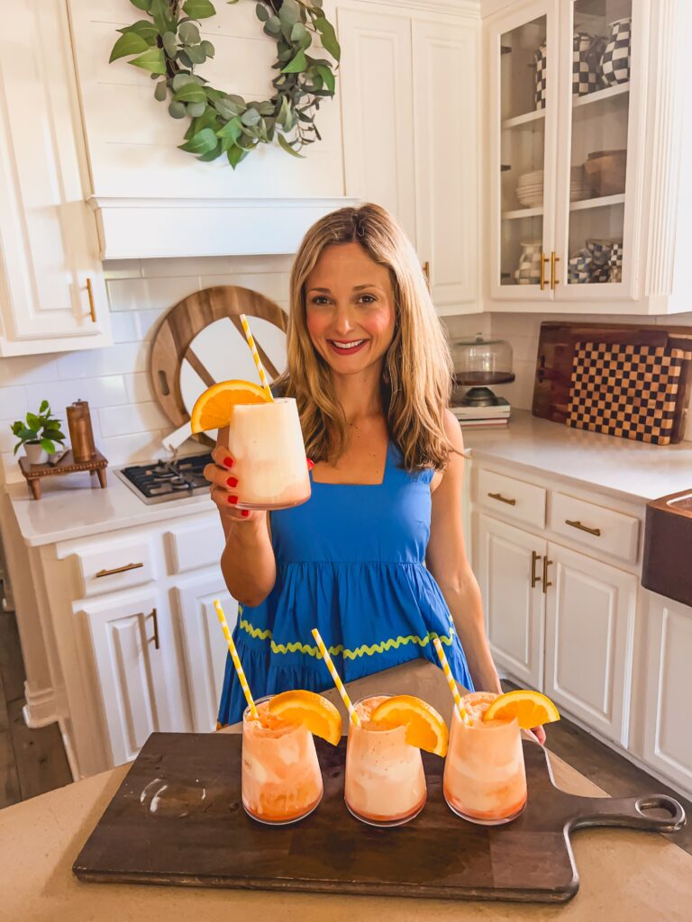 Leanna with Aperol Float cocktails in a sunny white kitchen