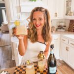 Leanna holding a glass of Prosecco Margaritas