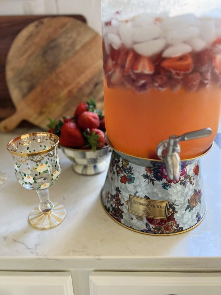 Strawberry Lemonade Sangria in a floral dispenser