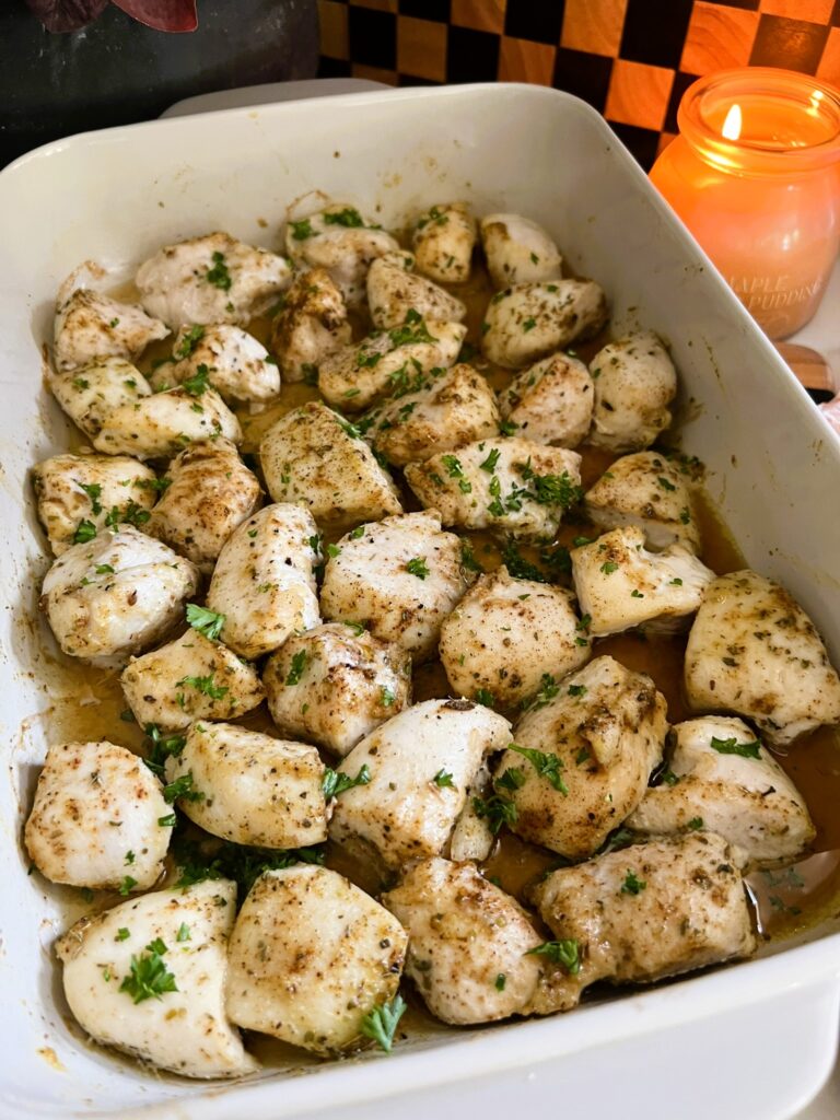 Baked Chicken Bites in a white baking pan