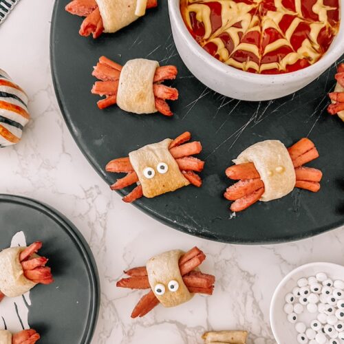 hot dog spiders attached with candy eyes with mustard