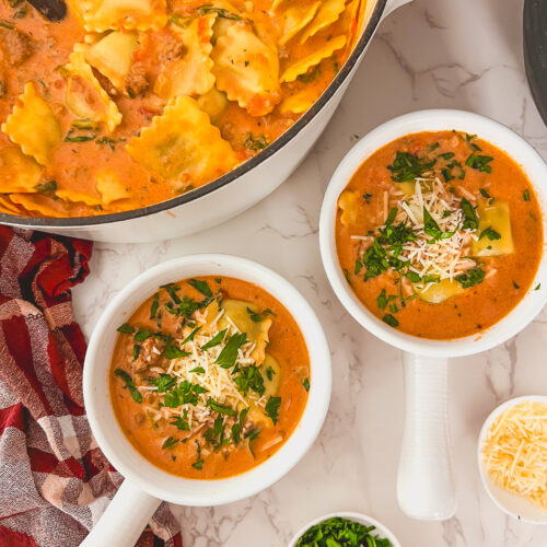 Creamy ravioli soup in a white bowl, an easy family friendly dinner recipe