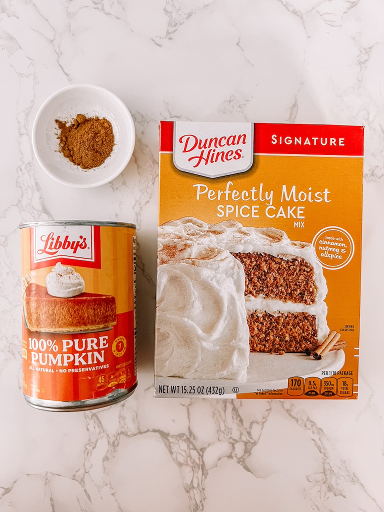 Ingredients for 3 ingredient pumpkin cookies including spice cake mix, canned pumpkin puree, and pumpkin pie spice.