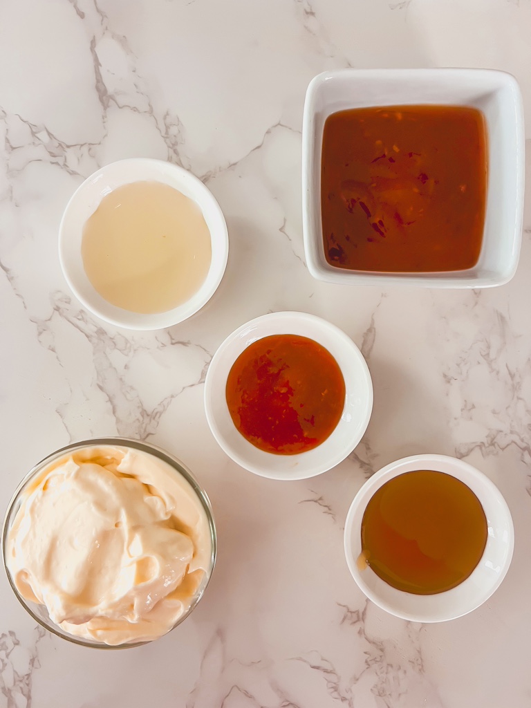 ayonnaise, sweet chili sauce, sriracha, and honey arranged for bang bang sauce