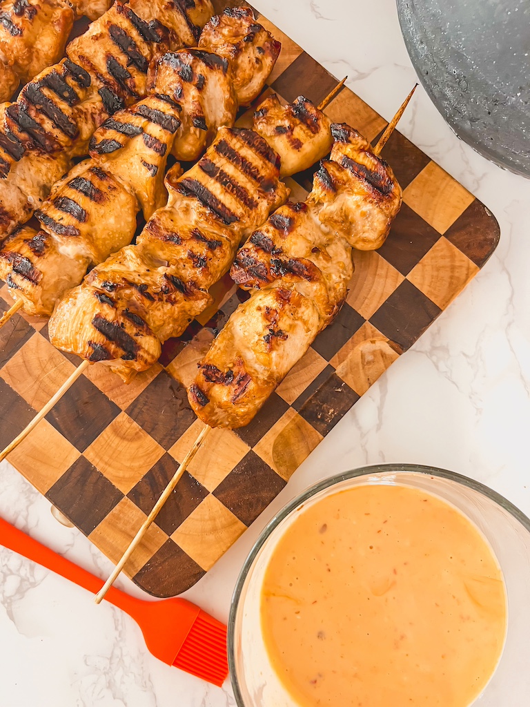 Bowl of homemade bang bang sauce with chicken ready