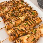 Flatlay of all bang bang chicken skewer ingredients styled on a kitchen counter
