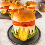 Creative Halloween food idea — spooky monster burgers.