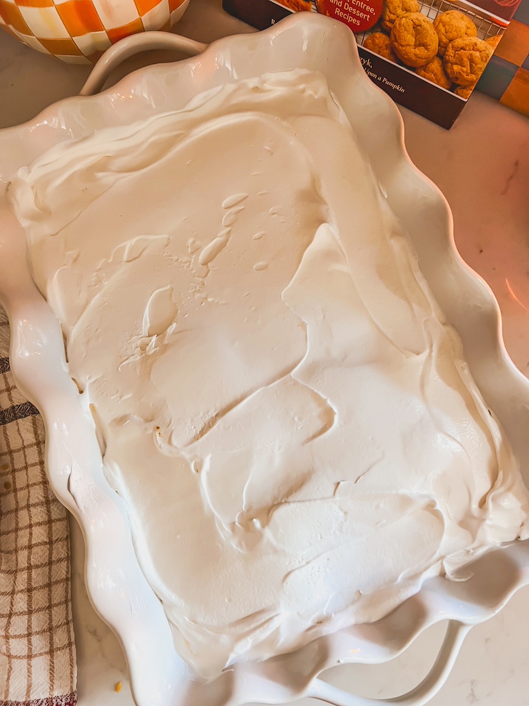 topping pumpkin delight with fluffy Cool Whip