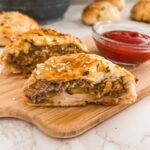 cheesy gooey cheeseburger bomb with pickles and ketchup