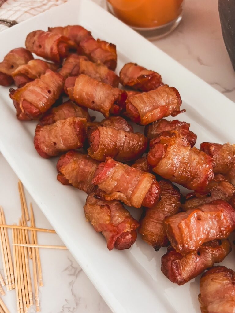 flatlay of brown sugar smokies on a white tray