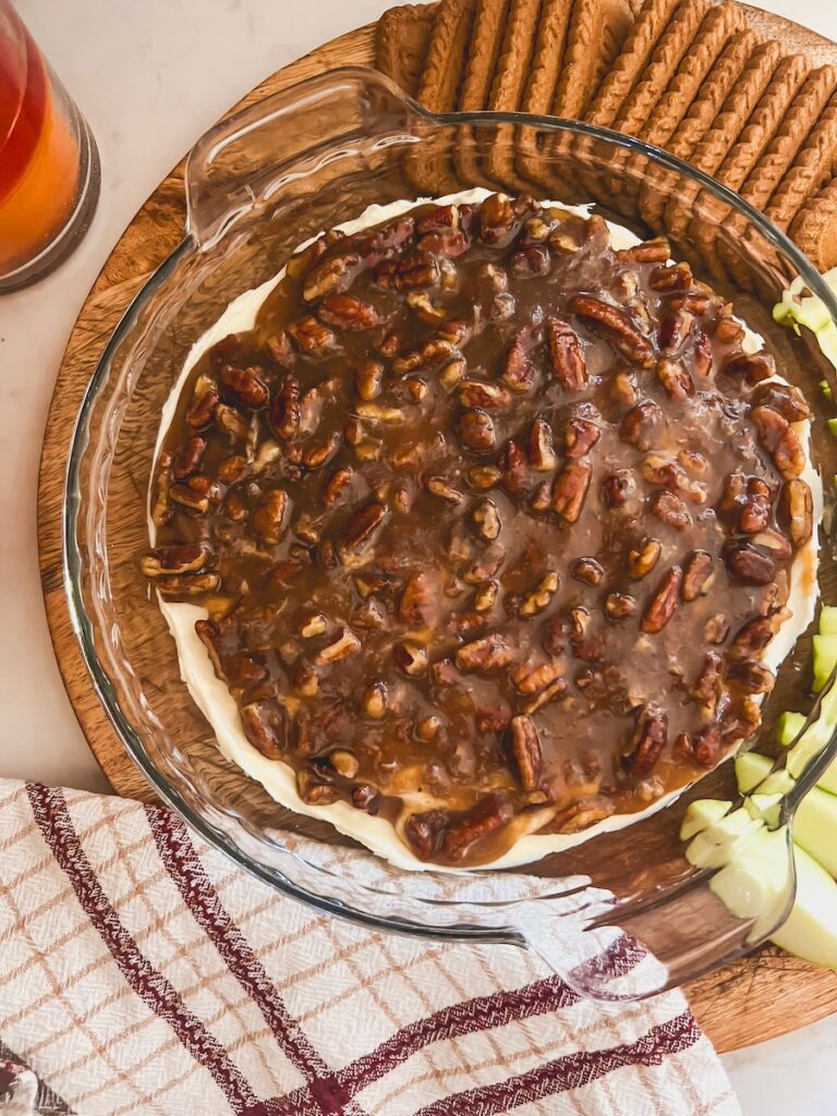 pecan pie dip in glass pie dish with apples and cookies
