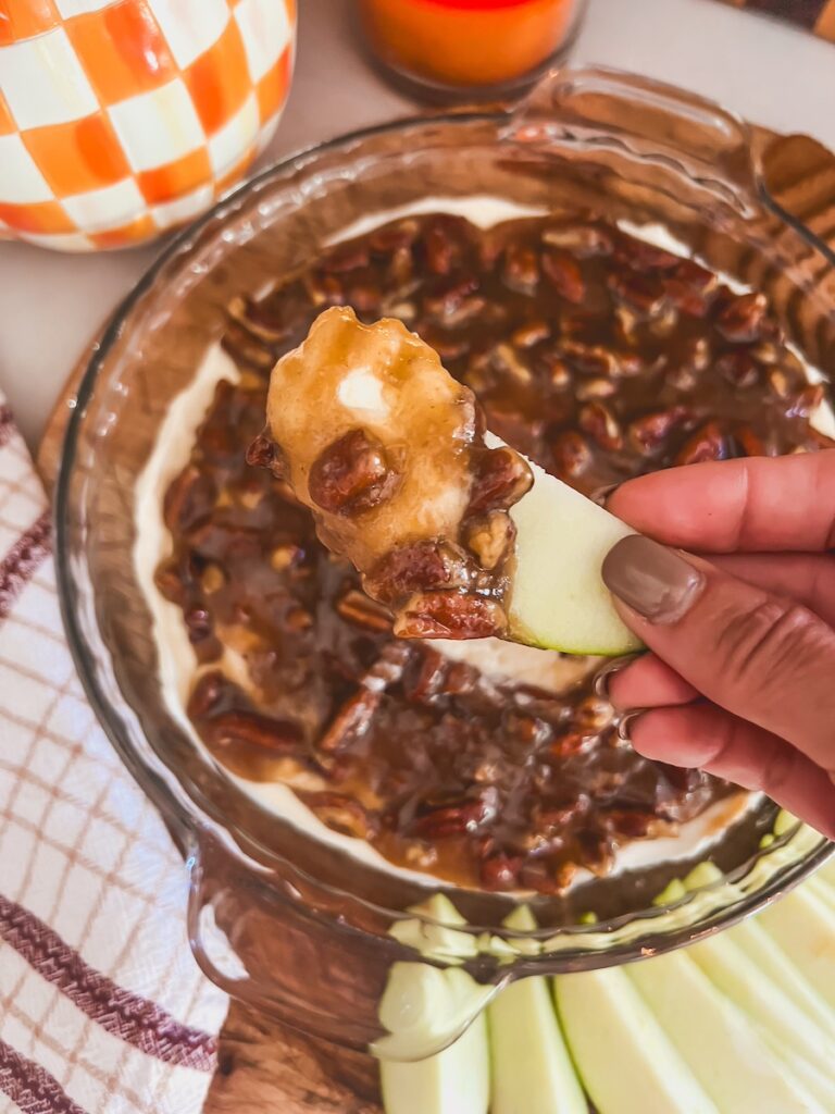 a scoop of pecan pie dip on a green apple slice
