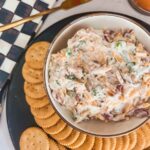neiman marcus dip with crackers on a serving platter