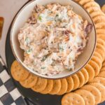 neiman marcus dip on black serving board with crackers