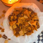 flat lay of million dollar snack mix in white pumpkin bowl