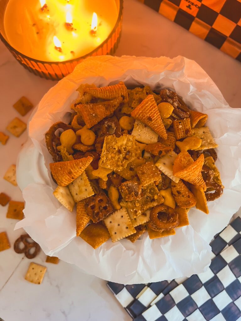 flat lay of million dollar snack mix in white pumpkin bowl