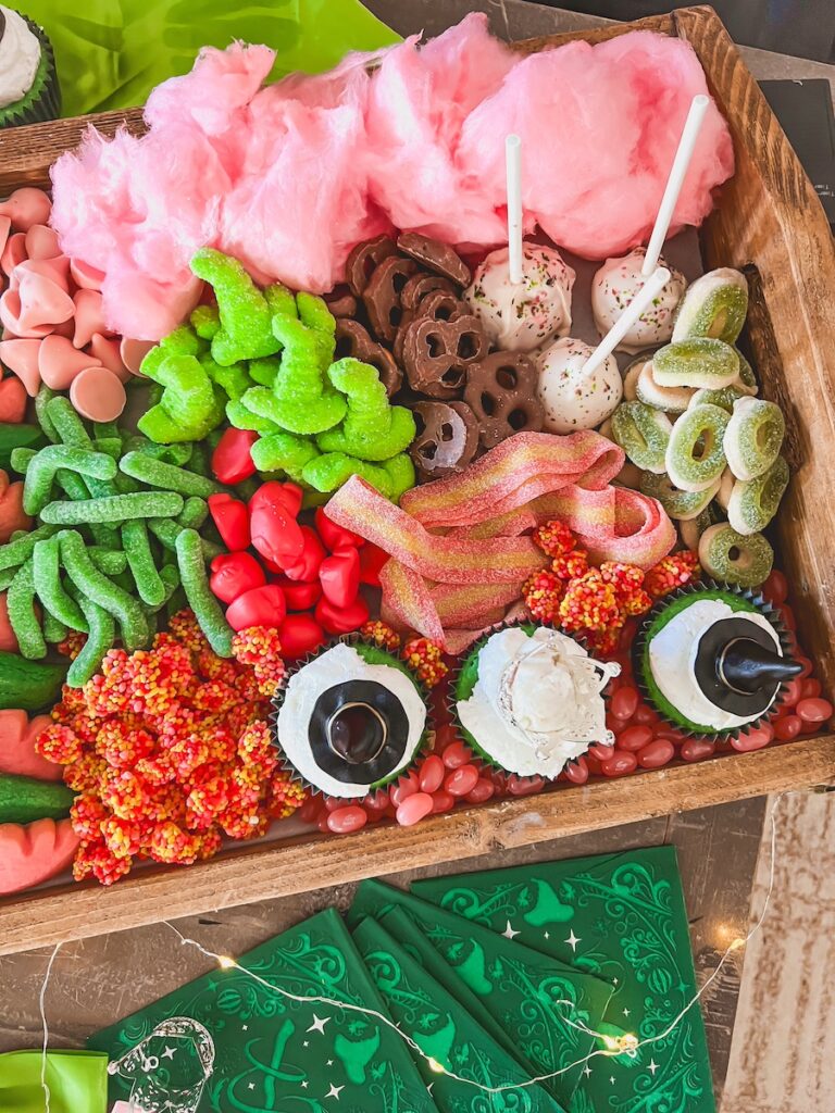 cupcakes and cakepops surrounded by pink and green candy