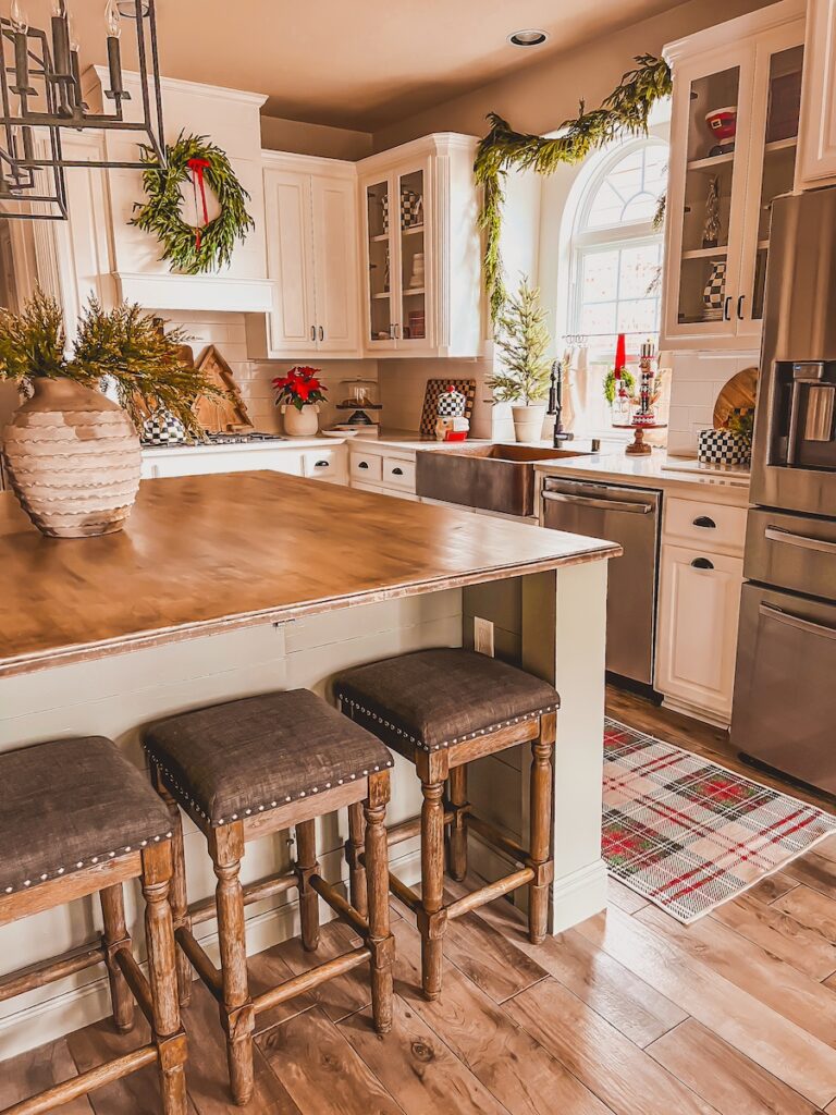 christmas kitchen decorated in classic red and green and tartan plaid
