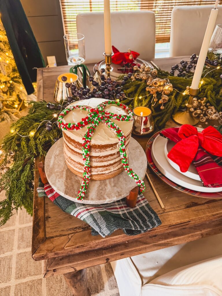 christmas bow cake on a festive christmas table