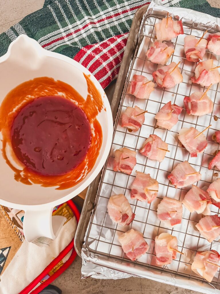 glaze next to bacon wraped chestnuts on a wire tray