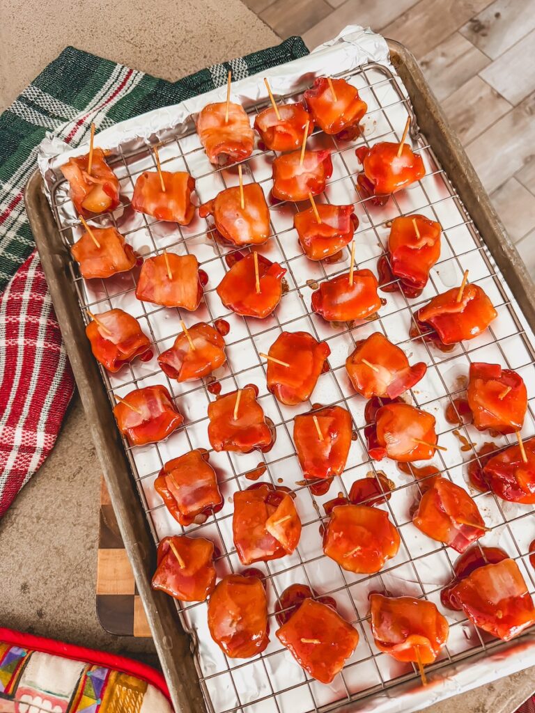 bacon wrapped chestnuts with glaze on wire tray