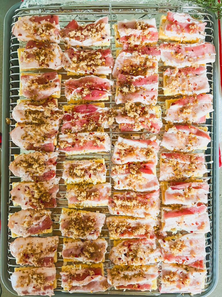 crackers and bacon layed on on wire tray