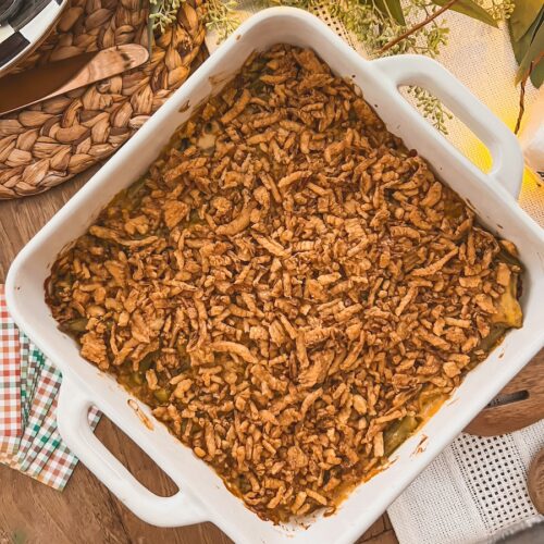 classic green bean casserole in a baking dish on a festive table