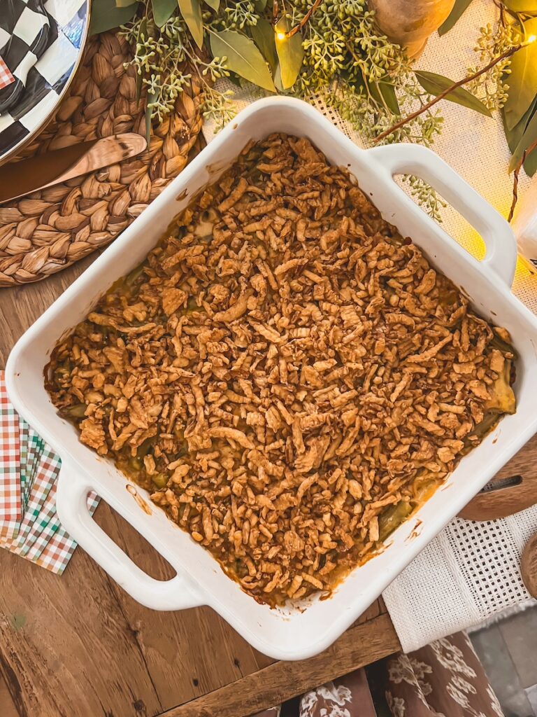 classic green bean casserole in a baking dish on a festive table