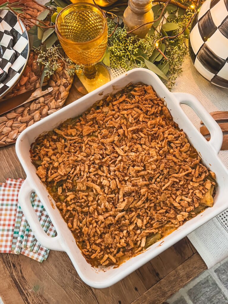 green bean casserole in a baking dish on a festive table