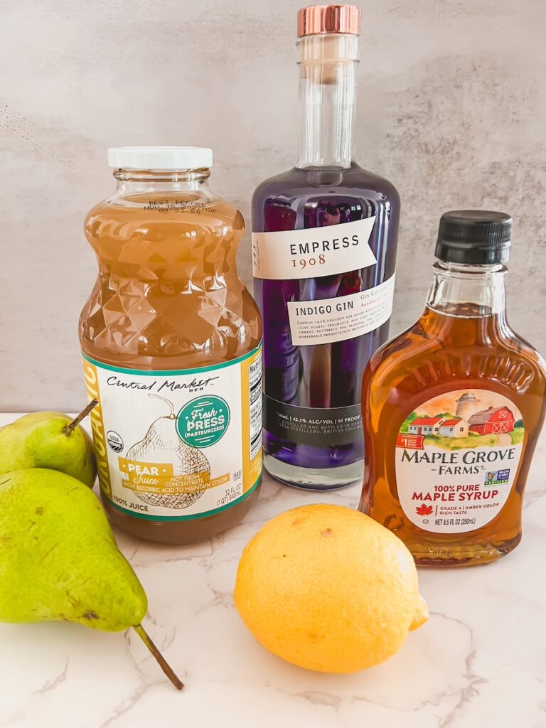 fall cocktail ingredients of pear juice, empress gin, maple syrup, lemon