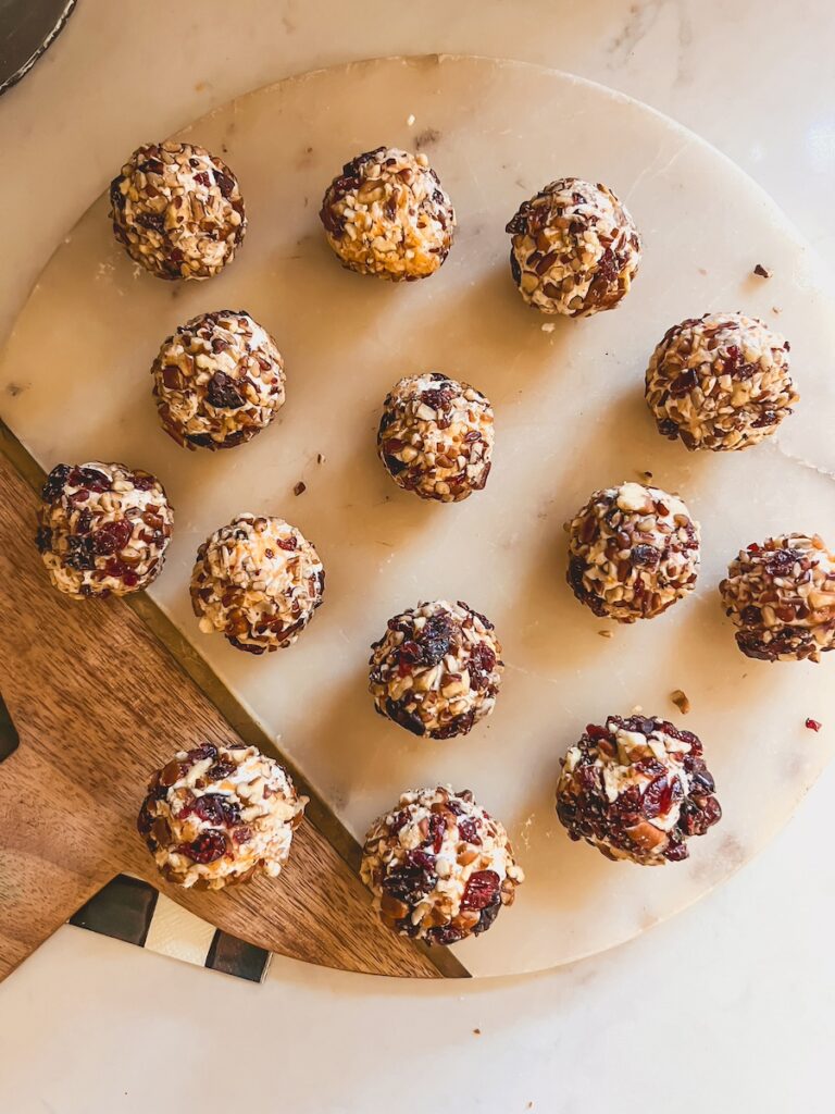 mini cheese balls rolls into pecan and cranberry