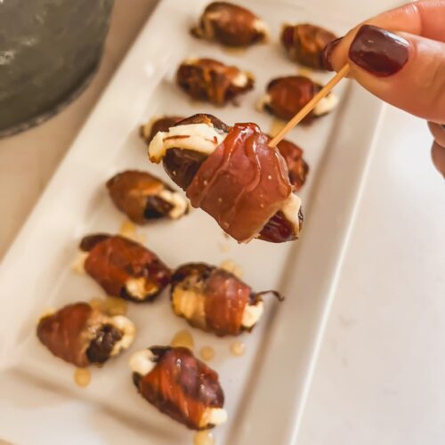 a prosciutto wrapped date on a toothpick
