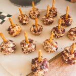 pretzel sticks in mini cheese balls on a platter