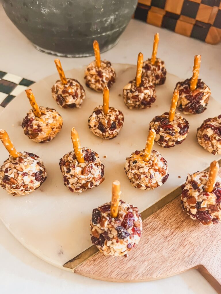 pretzel sticks in mini cheese balls on a platter