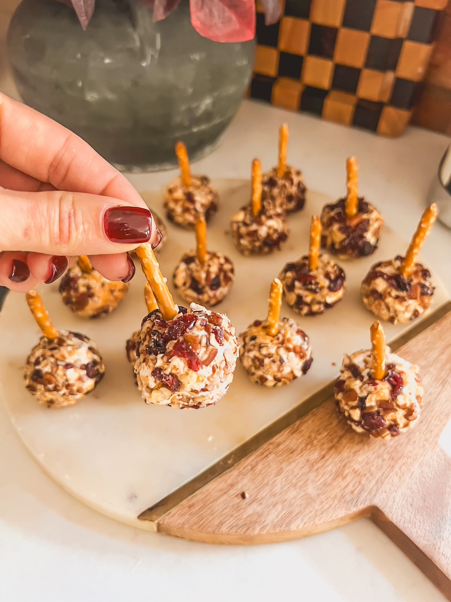 mini pecan and cranberry cheese balls on a platter