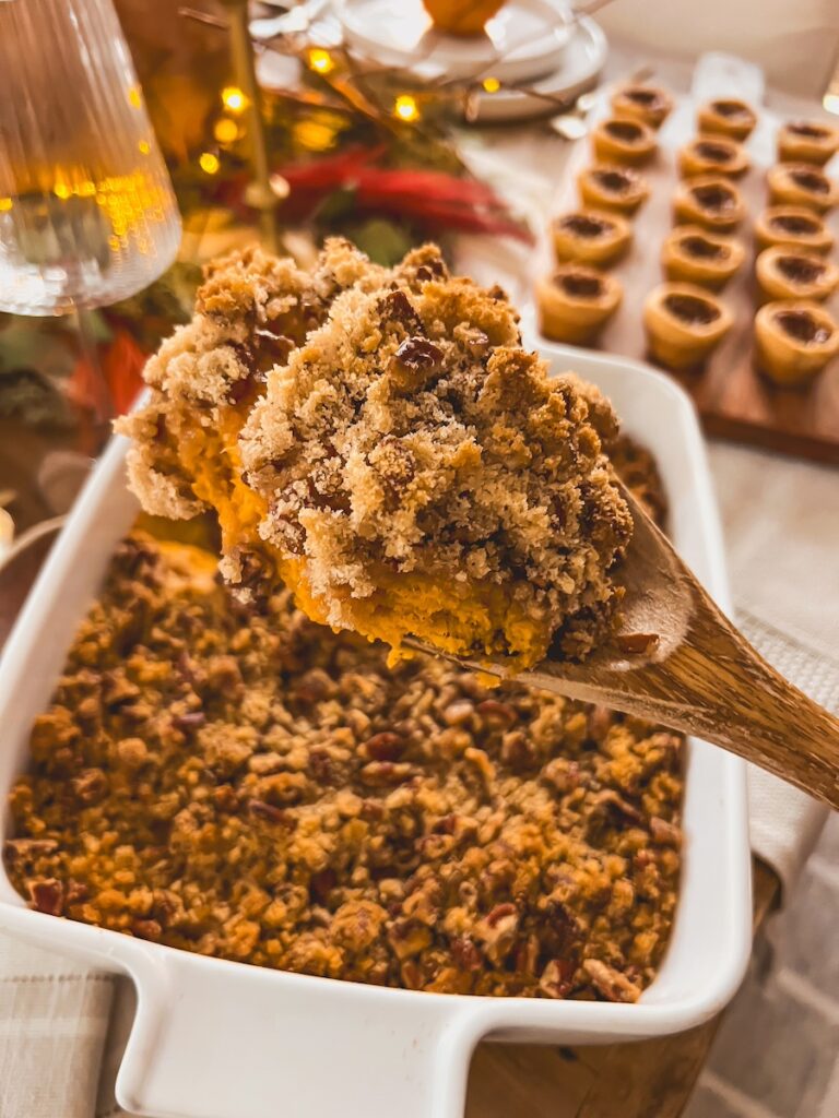a spoon full of sweet potato casserole