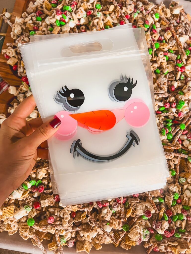 snowman bag with chex mix in the background