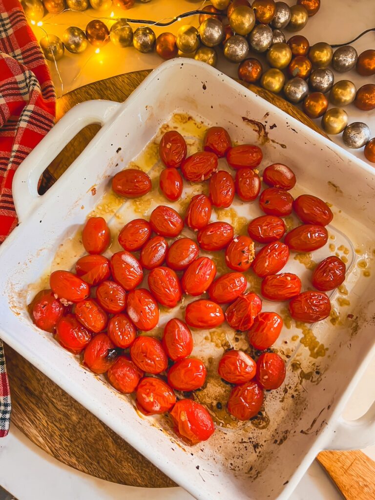 roasted tomatoes in a white baking dish