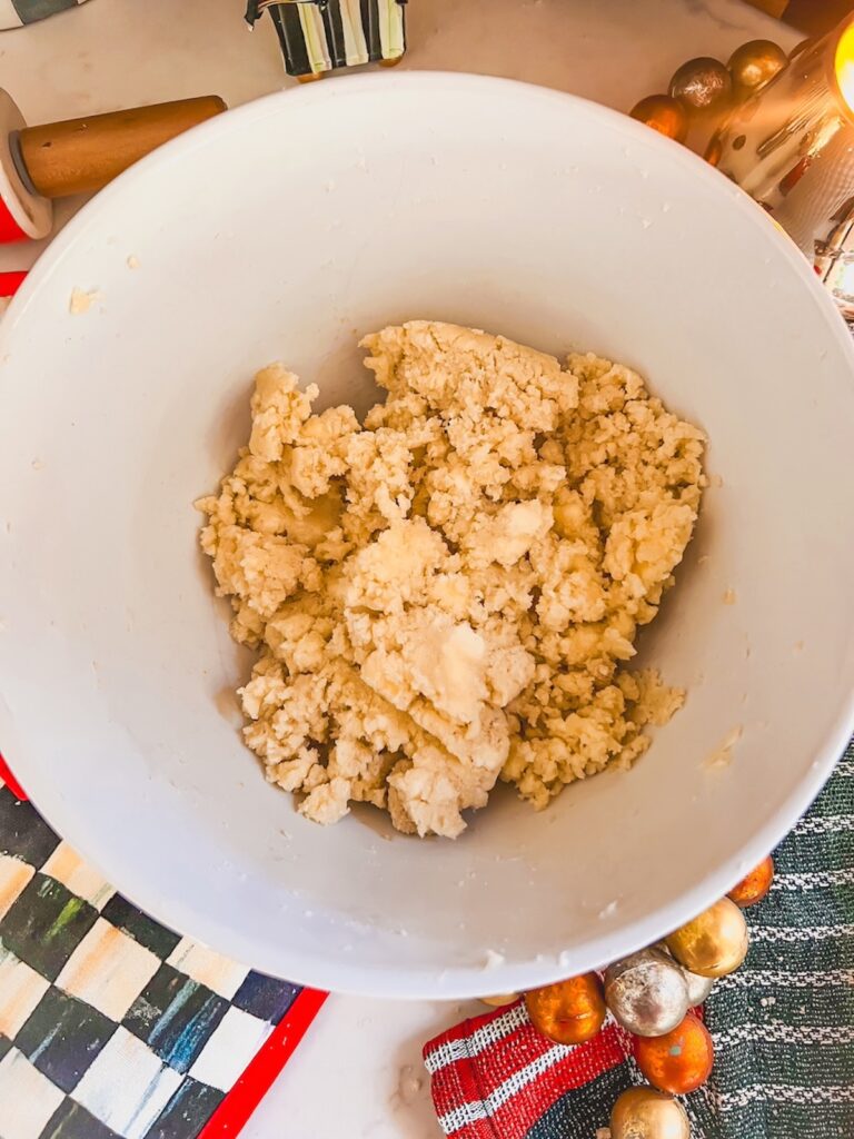 Butter and sugar beaten together in a white bowl. 