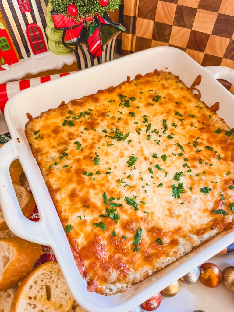Baked garlic bread dip in a white casserole dish