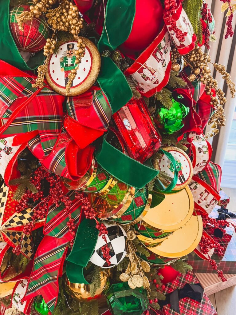 close up of christmas ornaments lahered in green gold and red